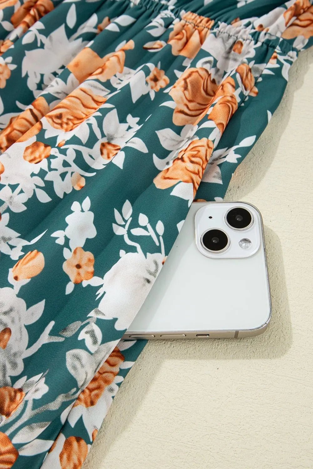 Crowned Energy CO. Floral / S Trendsi Dresses Floral Print Trimmed V Neck Tie Waist Sleeveless Dress