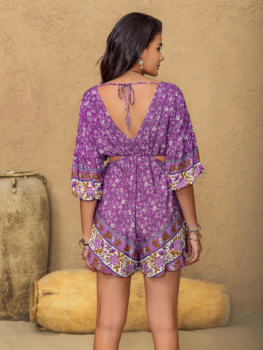 Crowned Energy CO. Purple / S Trendsi Jumpsuit Tied Front Cutout Printed Romper